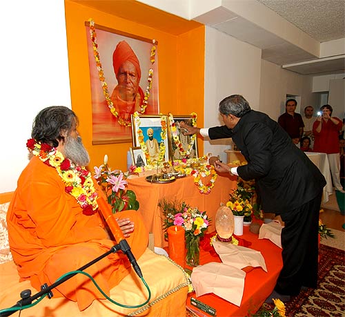 His Excellency Minister Tiwari performs the opening Puja (ceremony)